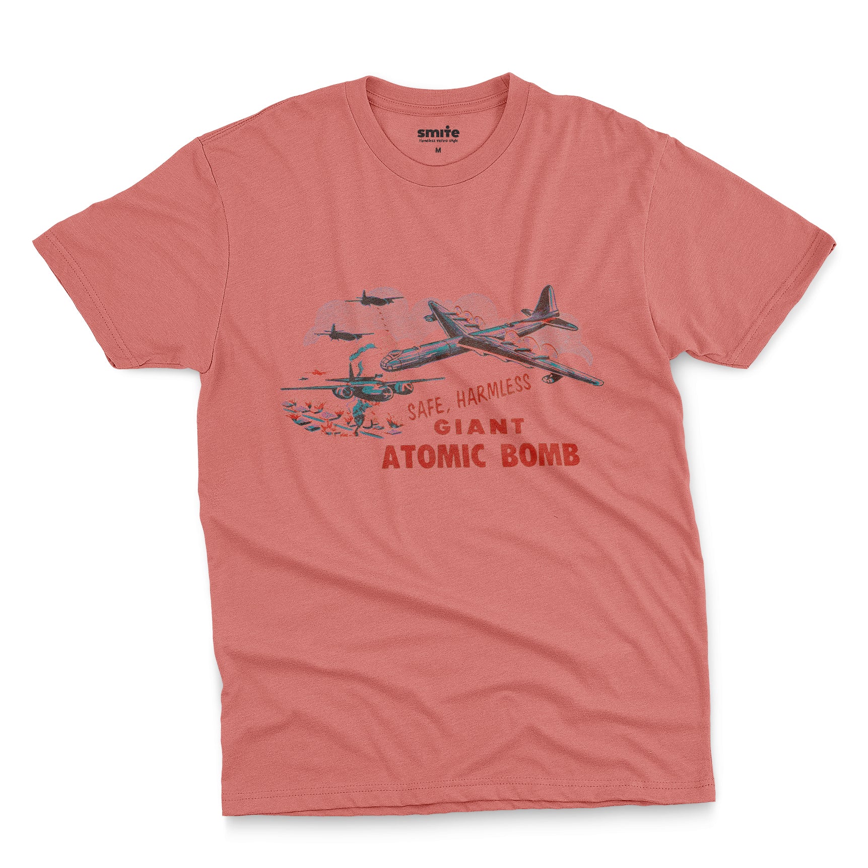 A coral pink t-shirt with the lid graphics from the 'Giant Atomic Bomb' toy packaging., popular in the 1960s.