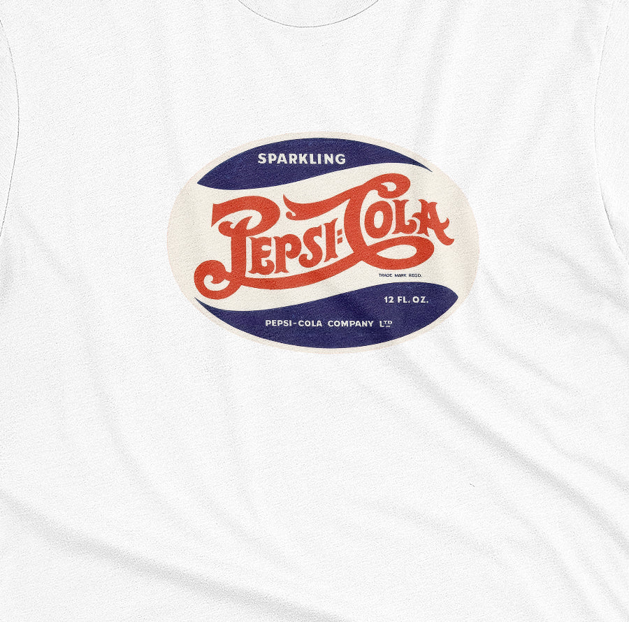A white t-shirt featuring a vintage hand lettered Pepsi-Cola logo from the 1940s.