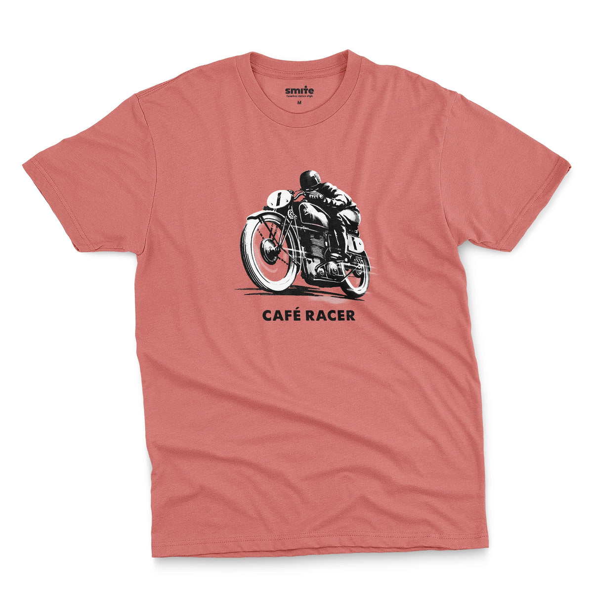 A coral pink t-shirt featuring a black and white graphic of a vintage motorcycle with a rider, with the text 'CAFÉ RACER' printed below it.