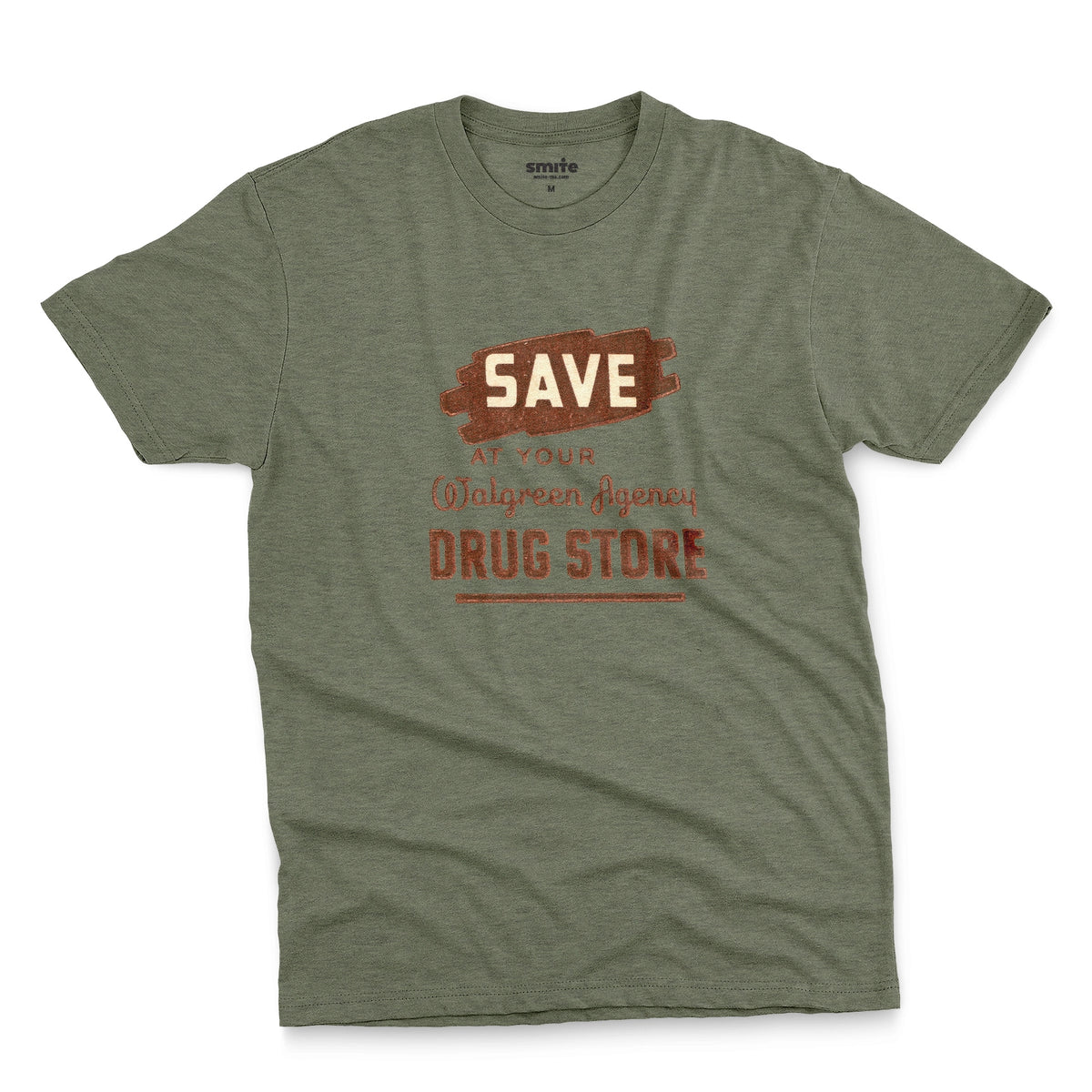A green t-shirt with a retro graphic print that reads 'SAVE AT YOUR Walgreen Agency DRUG STORE' from the 1960s.