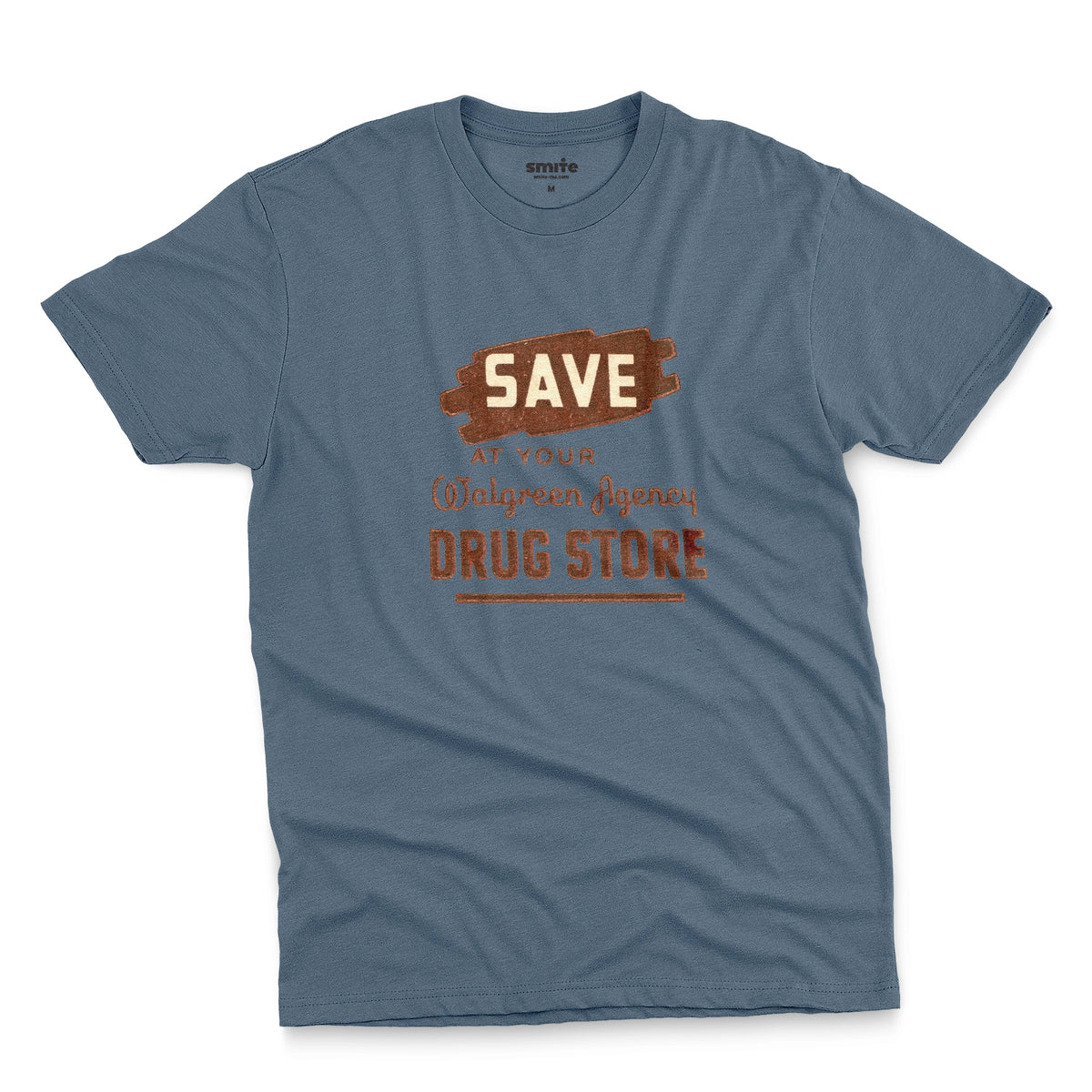 A blue t-shirt with a retro graphic print that reads 'SAVE AT YOUR Walgreen Agency DRUG STORE' from the 1960s.