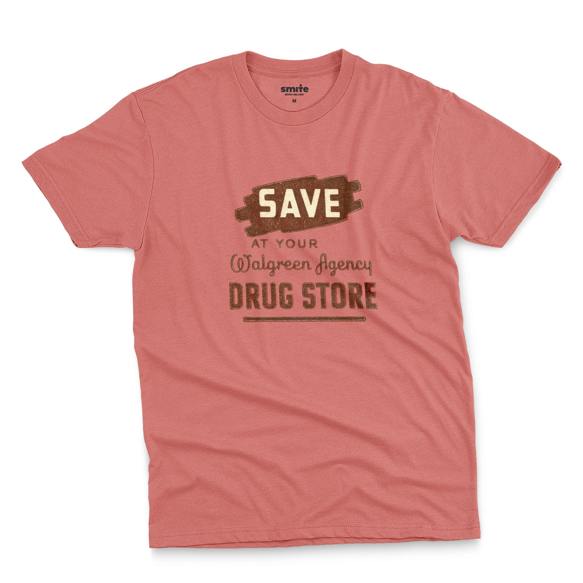 A coral pink t-shirt with a retro graphic print that reads 'SAVE AT YOUR Walgreen Agency DRUG STORE' from the 1960s.