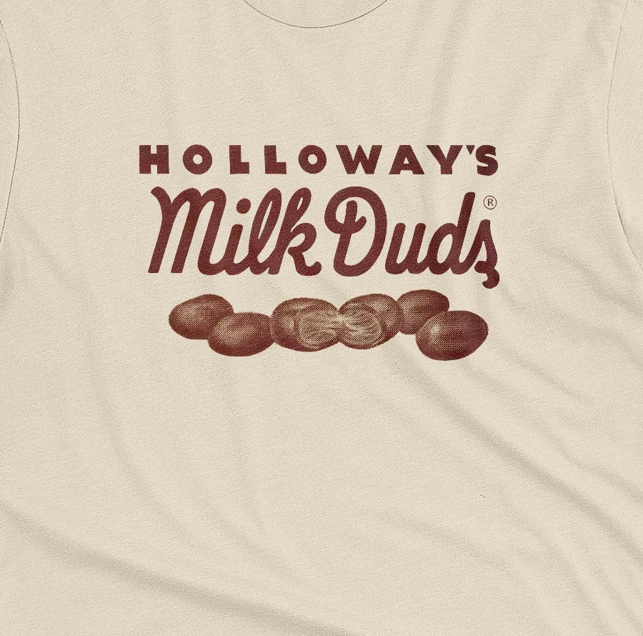A beige t-shirt with vintage Milk Duds packaging graphics.