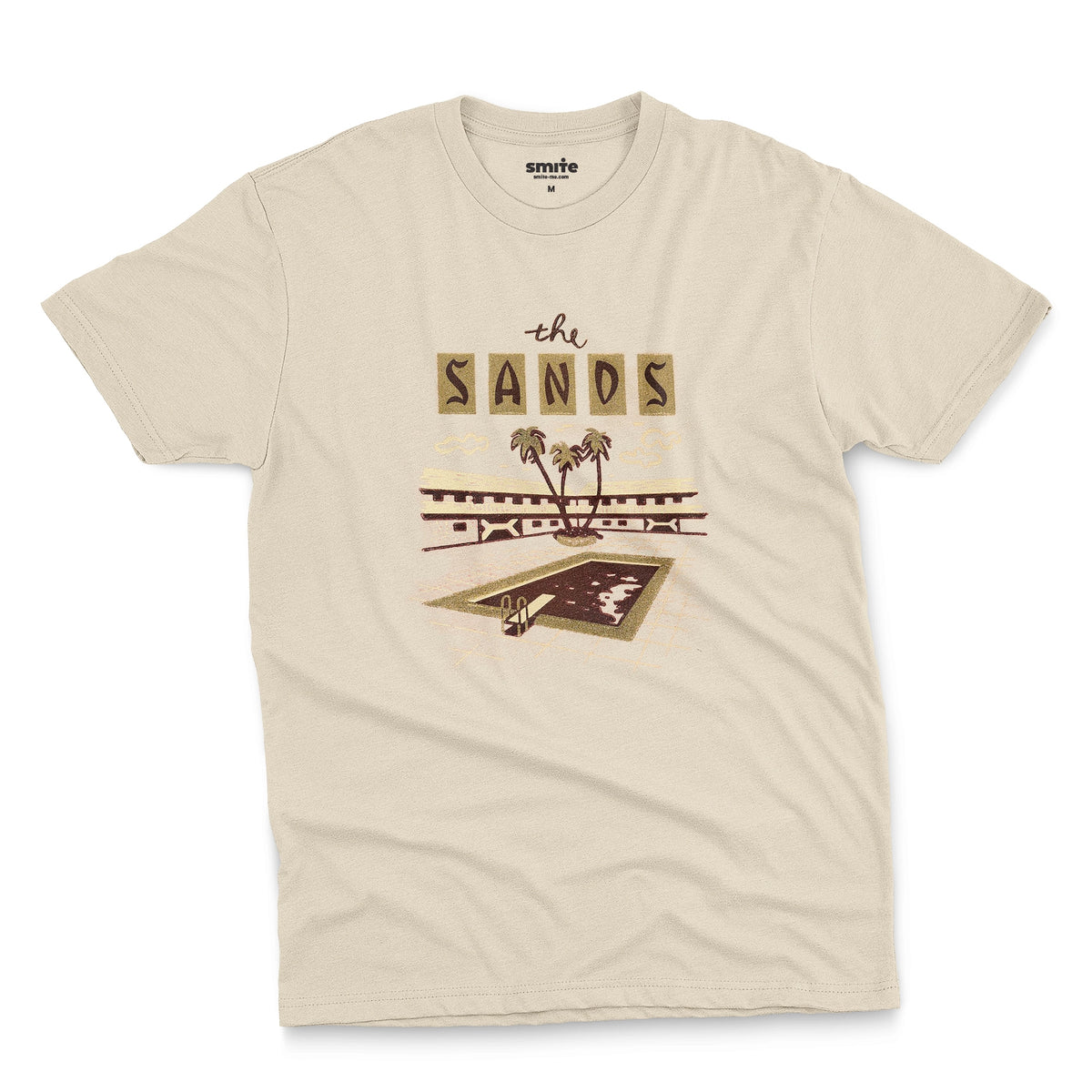 A beige t-shirt with a retro advertisement for 'the SANDS' hotel featuring a poolside scene.