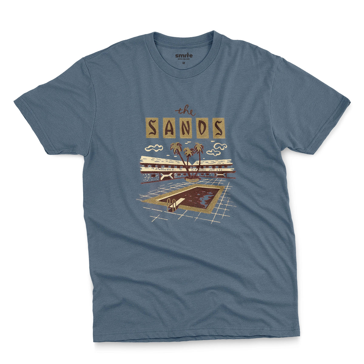 A blue t-shirt with a retro advertisement for 'the SANDS' hotel featuring a poolside scene.