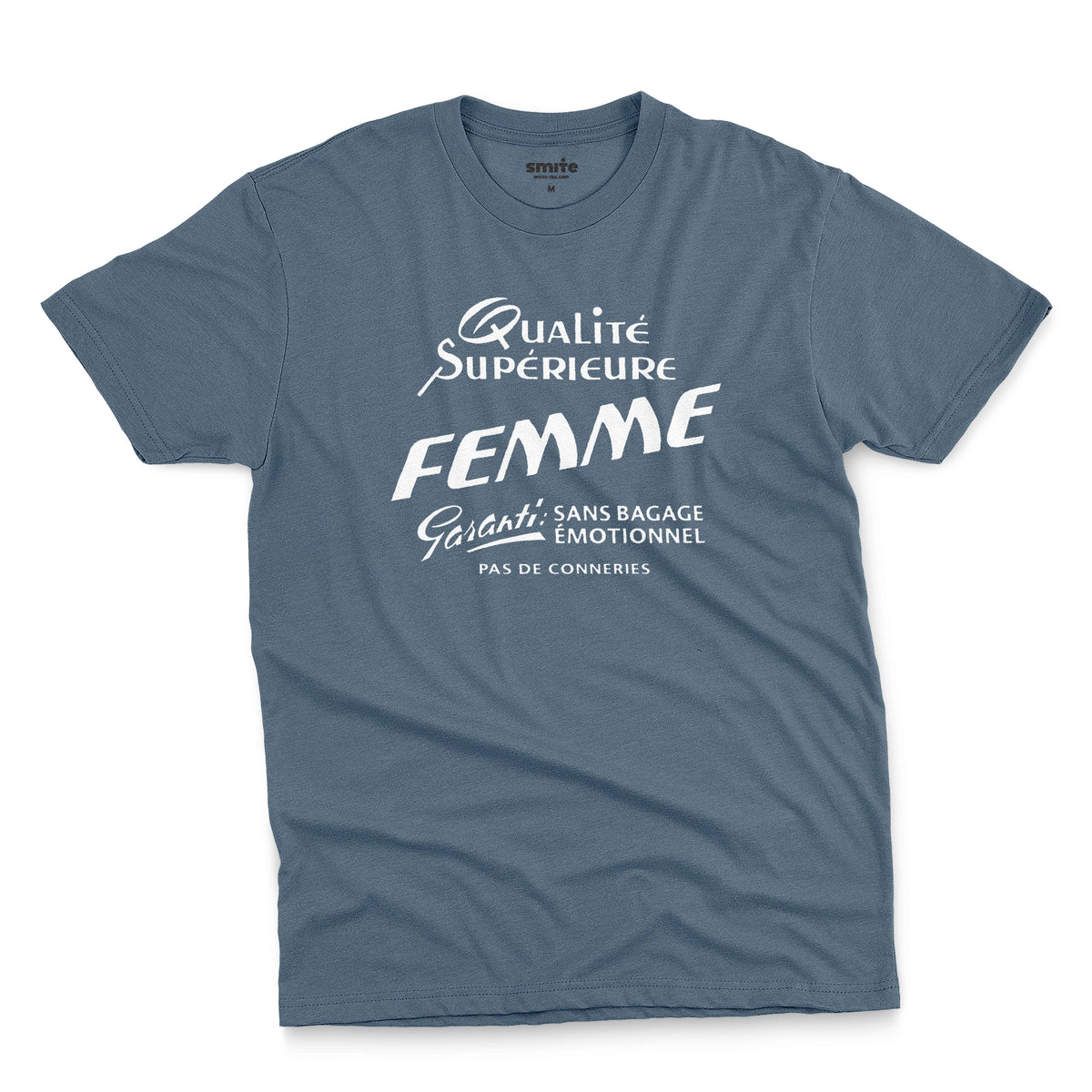 A blue t-shirt with white French text printed on the front. It translates as 'Superior Quality Woman Guarantee: No Emotional Baggage'.