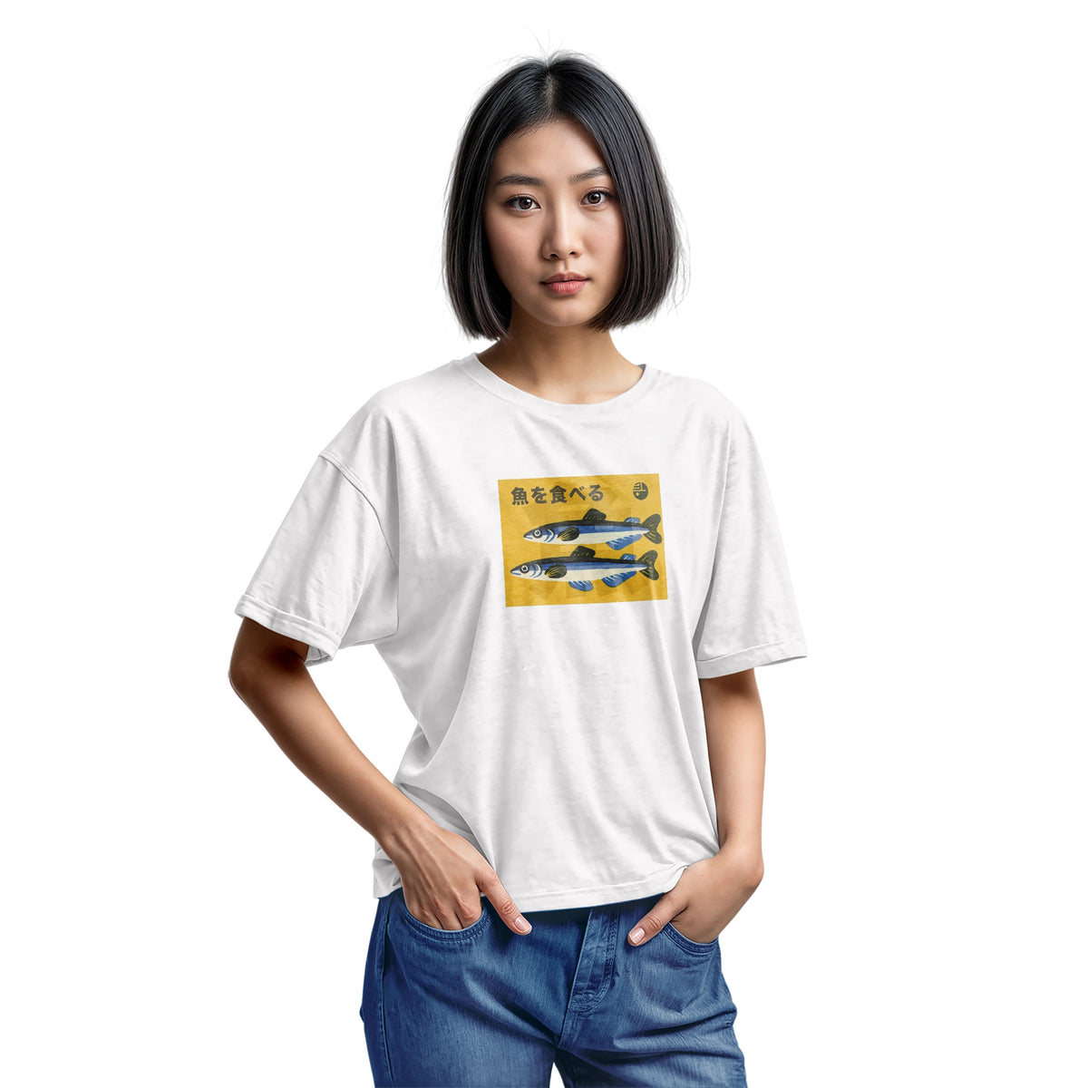 A white t-shirt with a rectangular graphic print on the chest showing two blue and silver fish on a yellow background with the Japanese text 'Eat Fish'.