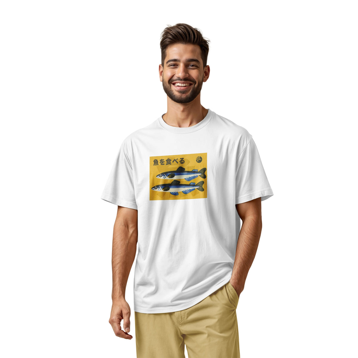 A white t-shirt with a rectangular graphic print on the chest showing two blue and silver fish on a yellow background with the Japanese text 'Eat Fish'.