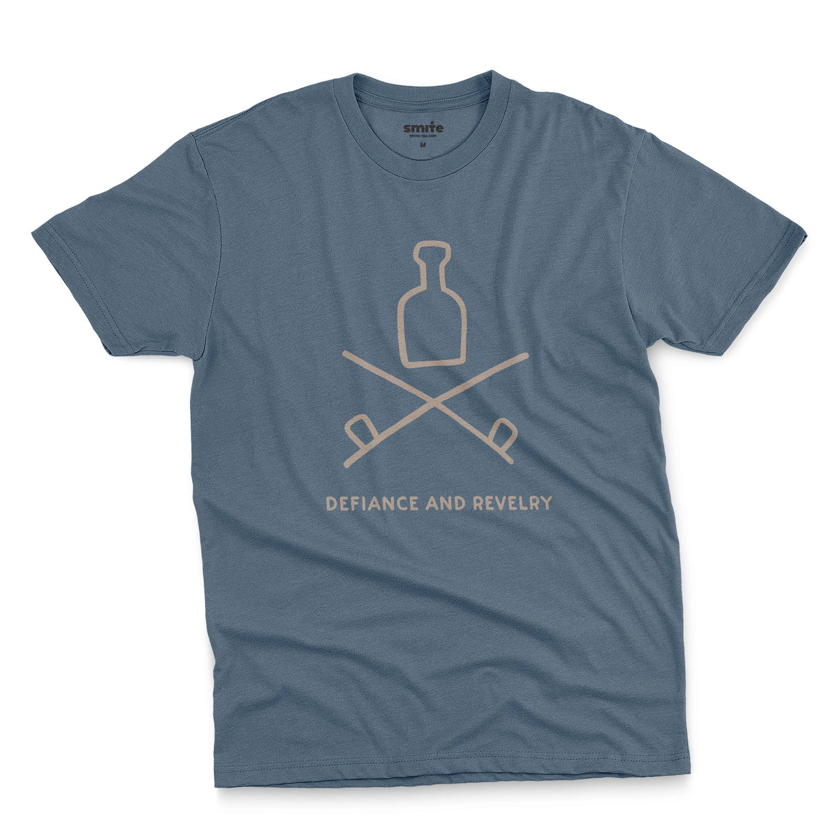 A blue t-shirt with a grey graphic of a bottle and crossed smoking pipes beneath it and the words defiance and revelry. The graphic is from an 1800s Australian convict tattoo.