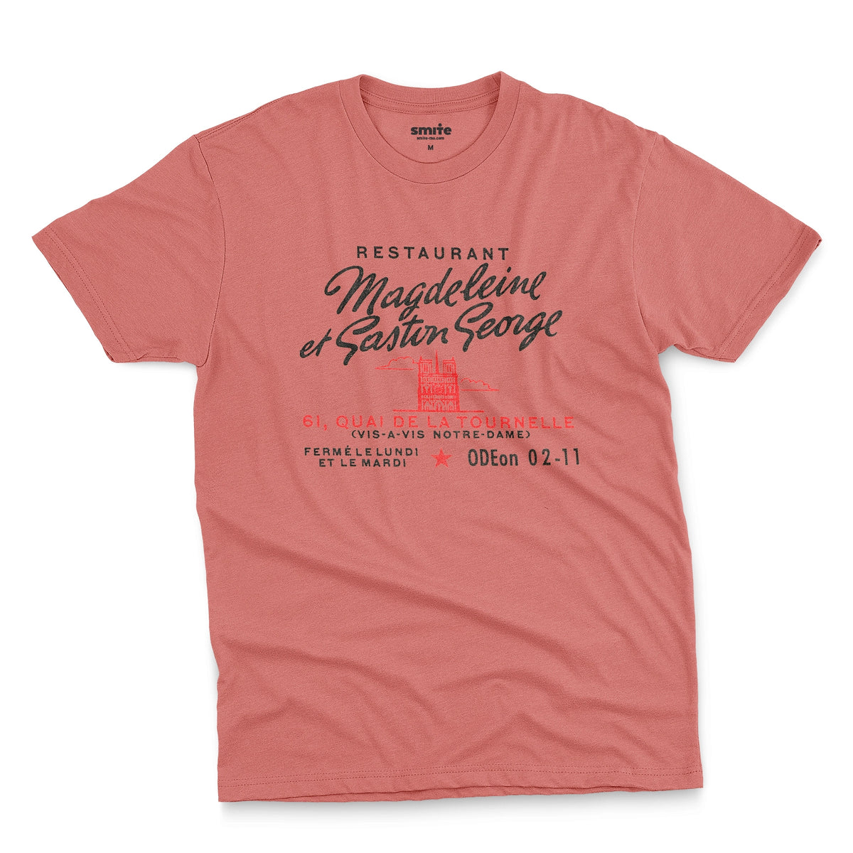 A coral pink t-shirt with a vintage advertisement for the 'Magdeleine et Gaston George' restaurant in Paris, France.