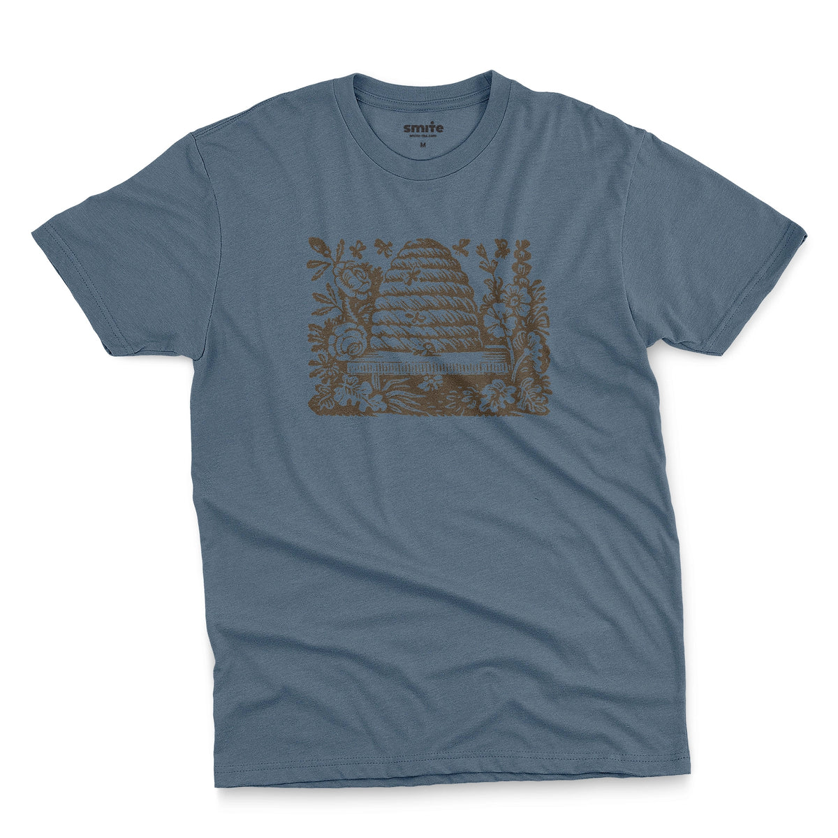 A blue t-shirt featuring a retro engraved graphic print of a beehive surrounded by flowers.