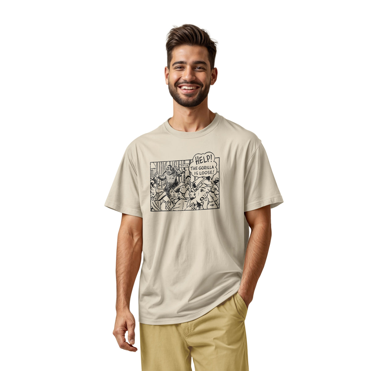A beige t-shirt featuring a retro comic-style graphic depicting a gorilla and the text 'HELP! THE GORILLA IS LOOSE!'.
