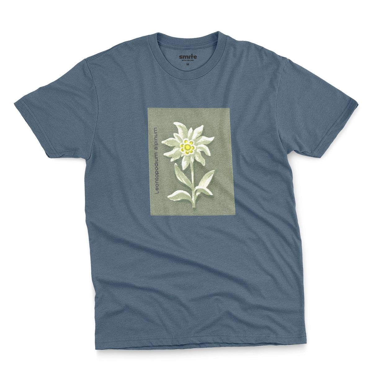 A blue t-shirt featuring a retro illustration of an Edelweiss flower from a 1960s European matchbook.