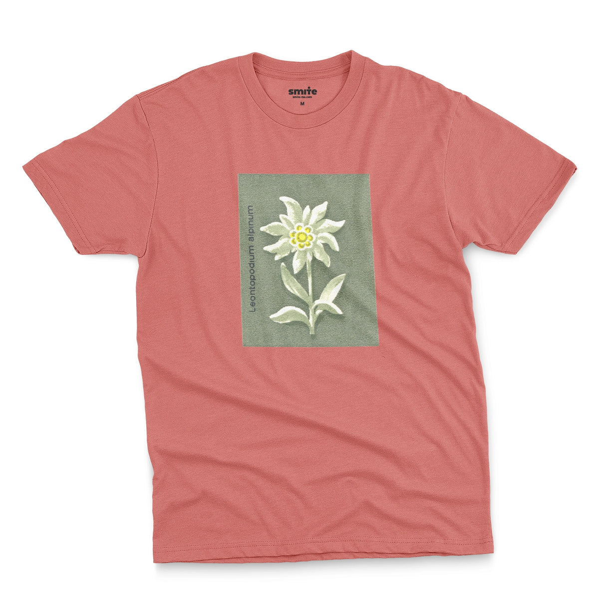A coral pink t-shirt featuring a retro illustration of an Edelweiss flower from a 1960s European matchbook.