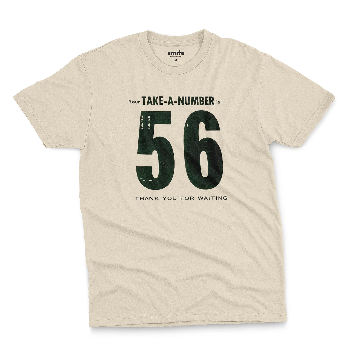 A beige t-shirt with a 1960s retro graphic reading 'Your TAKE-A-NUMBER is 56 THANK YOU FOR WAITING' in distressed typography.