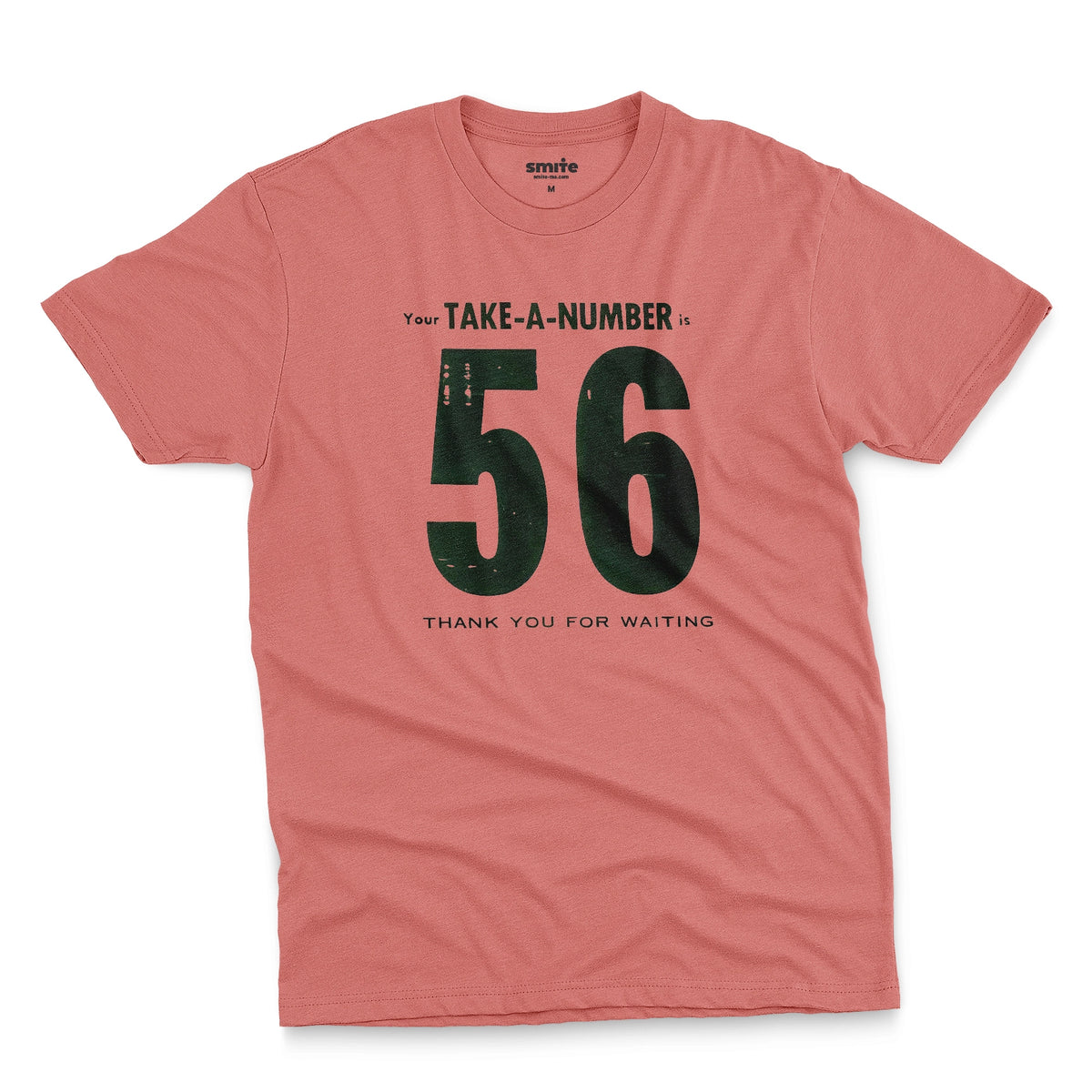 A coral pink t-shirt with a 1960s retro graphic reading 'Your TAKE-A-NUMBER is 56 THANK YOU FOR WAITING' in distressed typography.