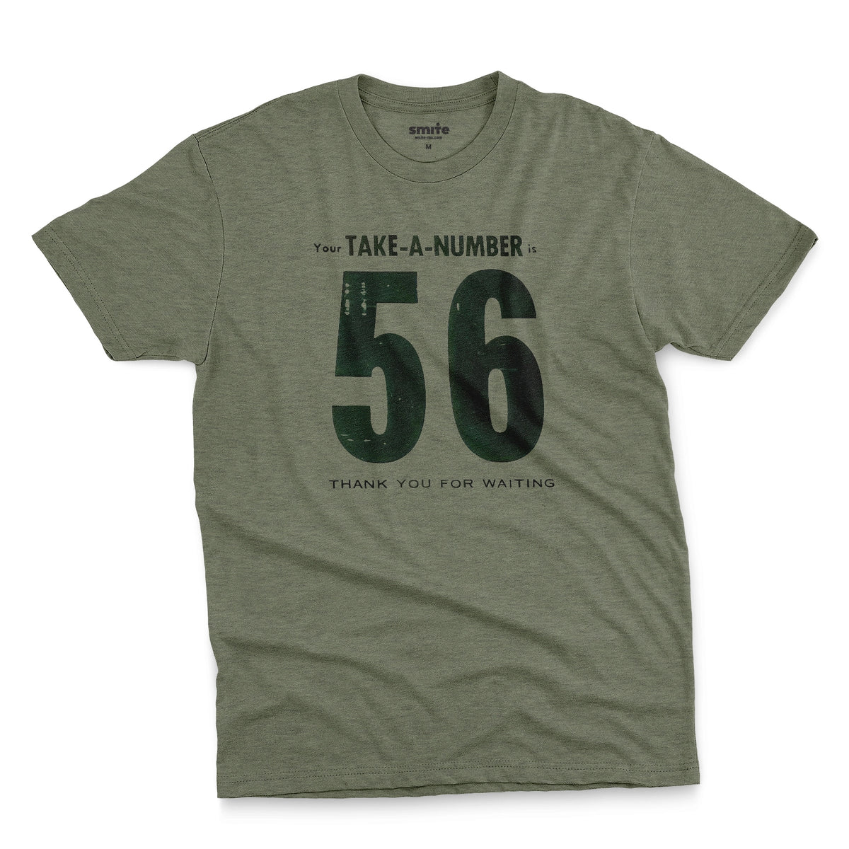 A green t-shirt with a 1960s retro graphic reading 'Your TAKE-A-NUMBER is 56 THANK YOU FOR WAITING' in distressed typography.