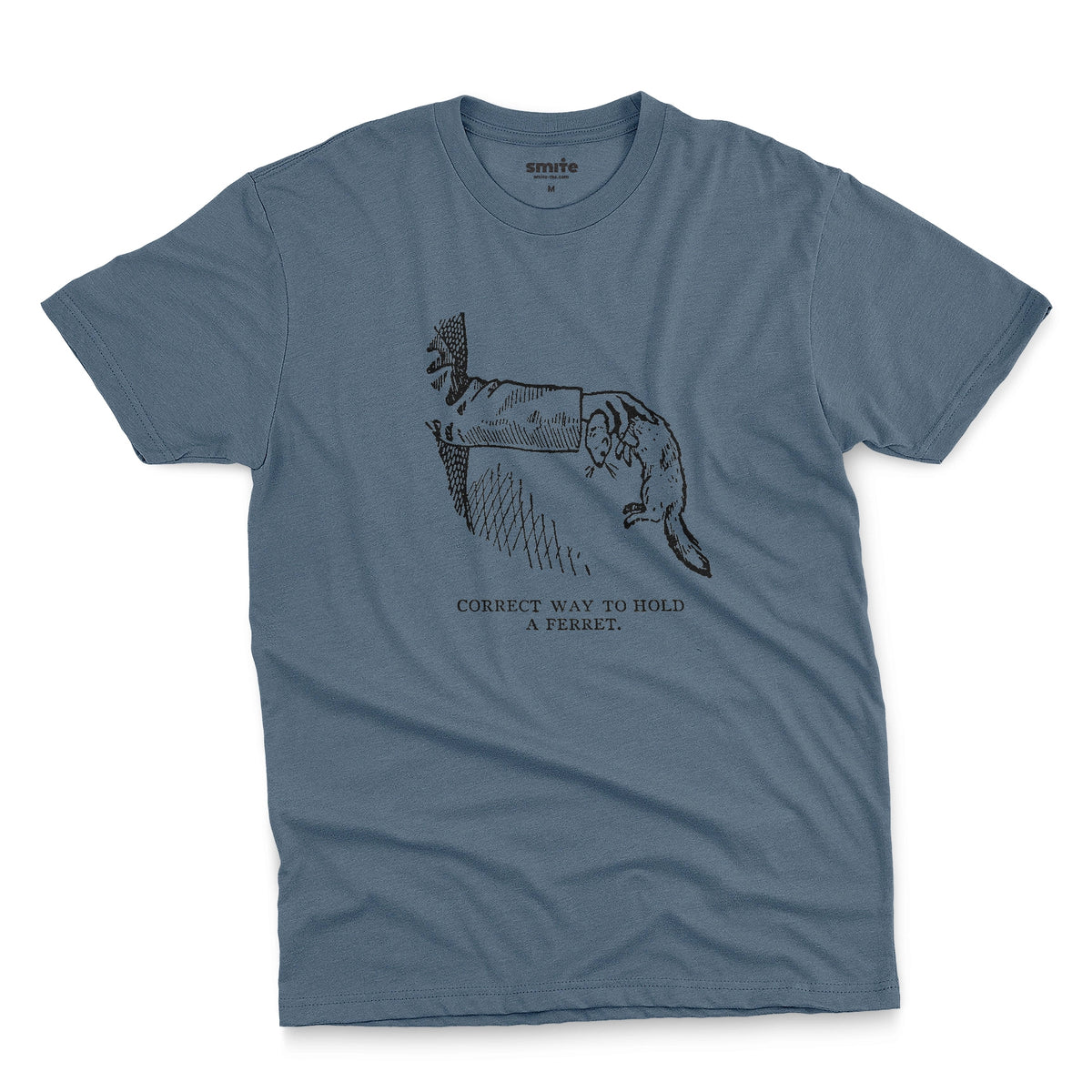 A blue t-shirt with a vintage engraved illustration of an arm holding a ferret and text saying: Correct way to hold a ferret.