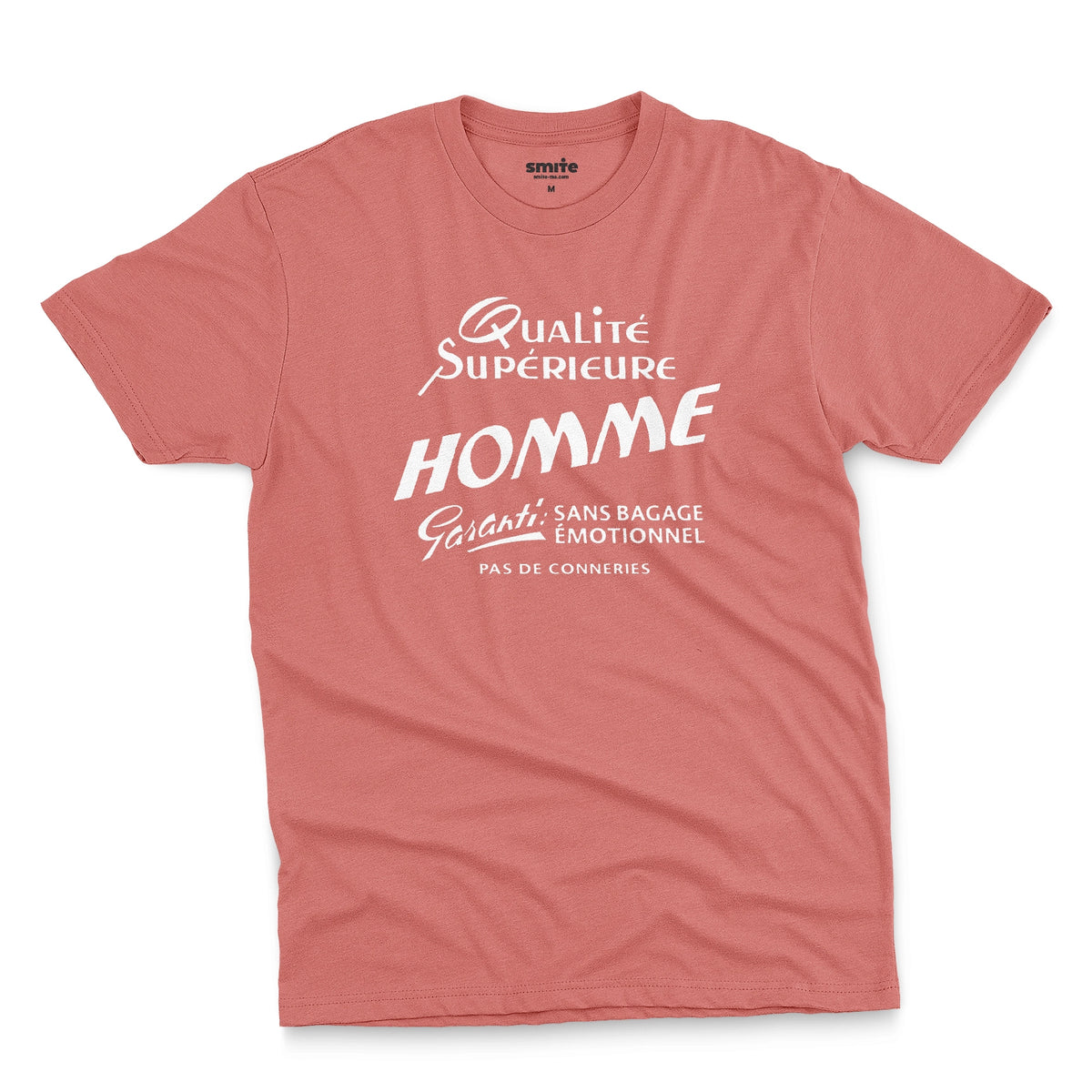 A coral pink t-shirt with white French text printed on the front. It translates as 'Superior Quality Man Guarantee: No Emotional Baggage'.