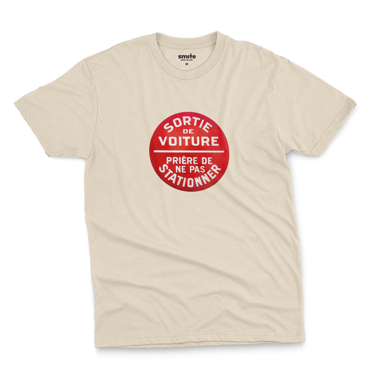 A beige t-shirt with a retro red and white graphic on the chest with French text 'SORTIE DE VOITURE PRIERE DE NE PAS STATIONNER'.