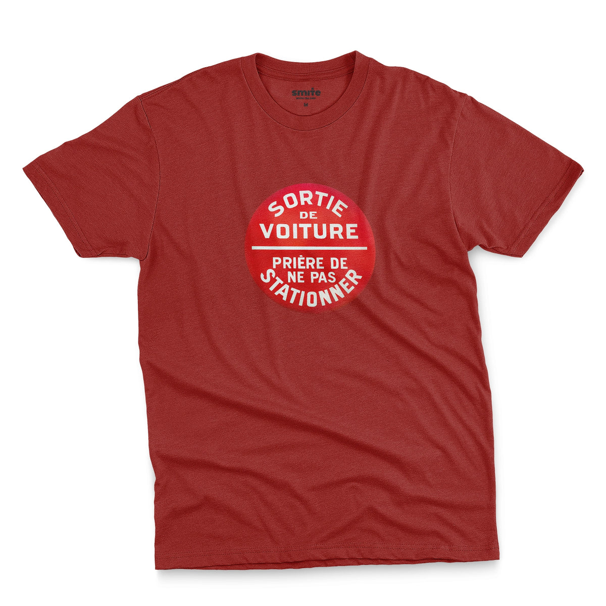 A red t-shirt with a retro red and white graphic on the chest with French text 'SORTIE DE VOITURE PRIERE DE NE PAS STATIONNER'.