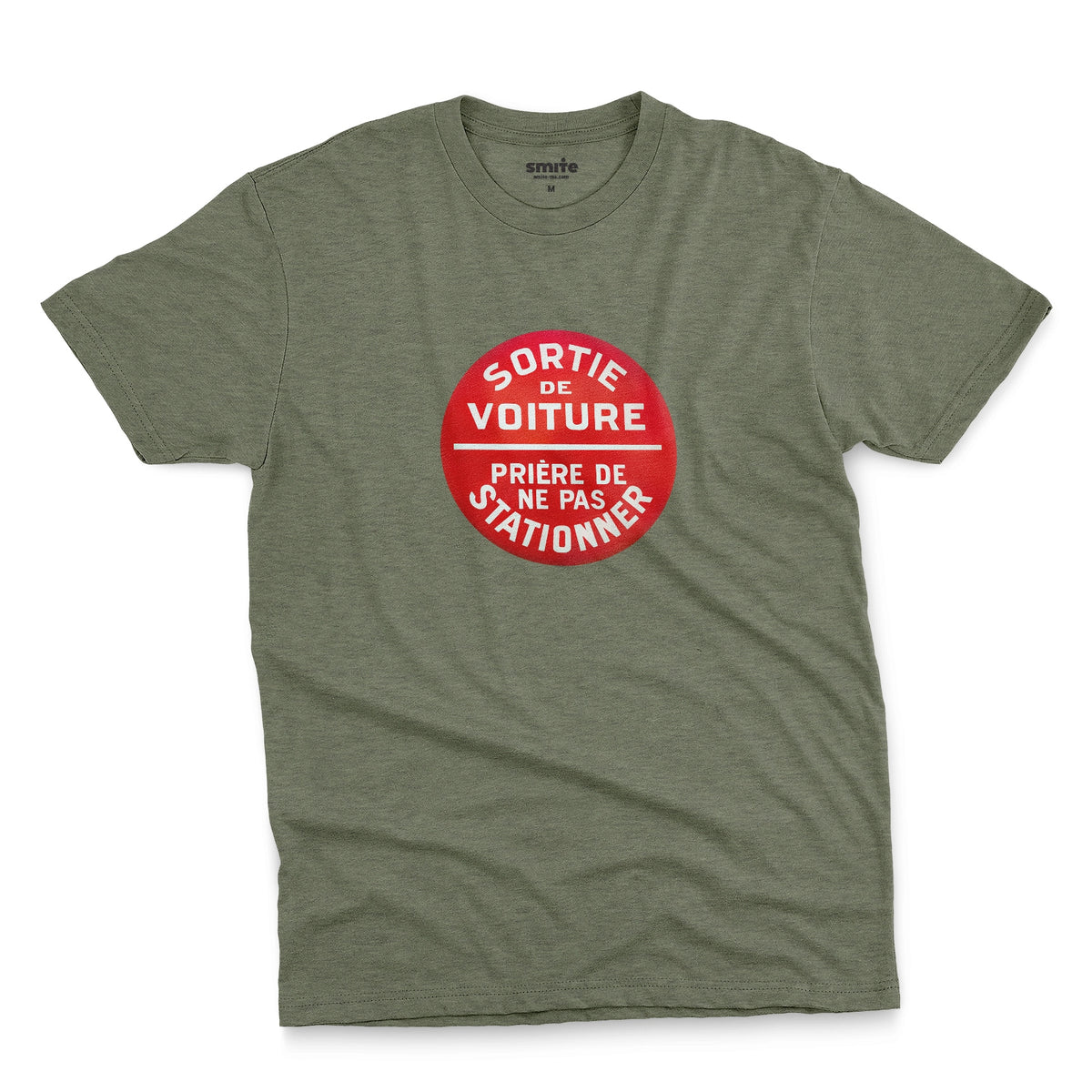 A green t-shirt with a retro red and white graphic on the chest with French text 'SORTIE DE VOITURE PRIERE DE NE PAS STATIONNER'.