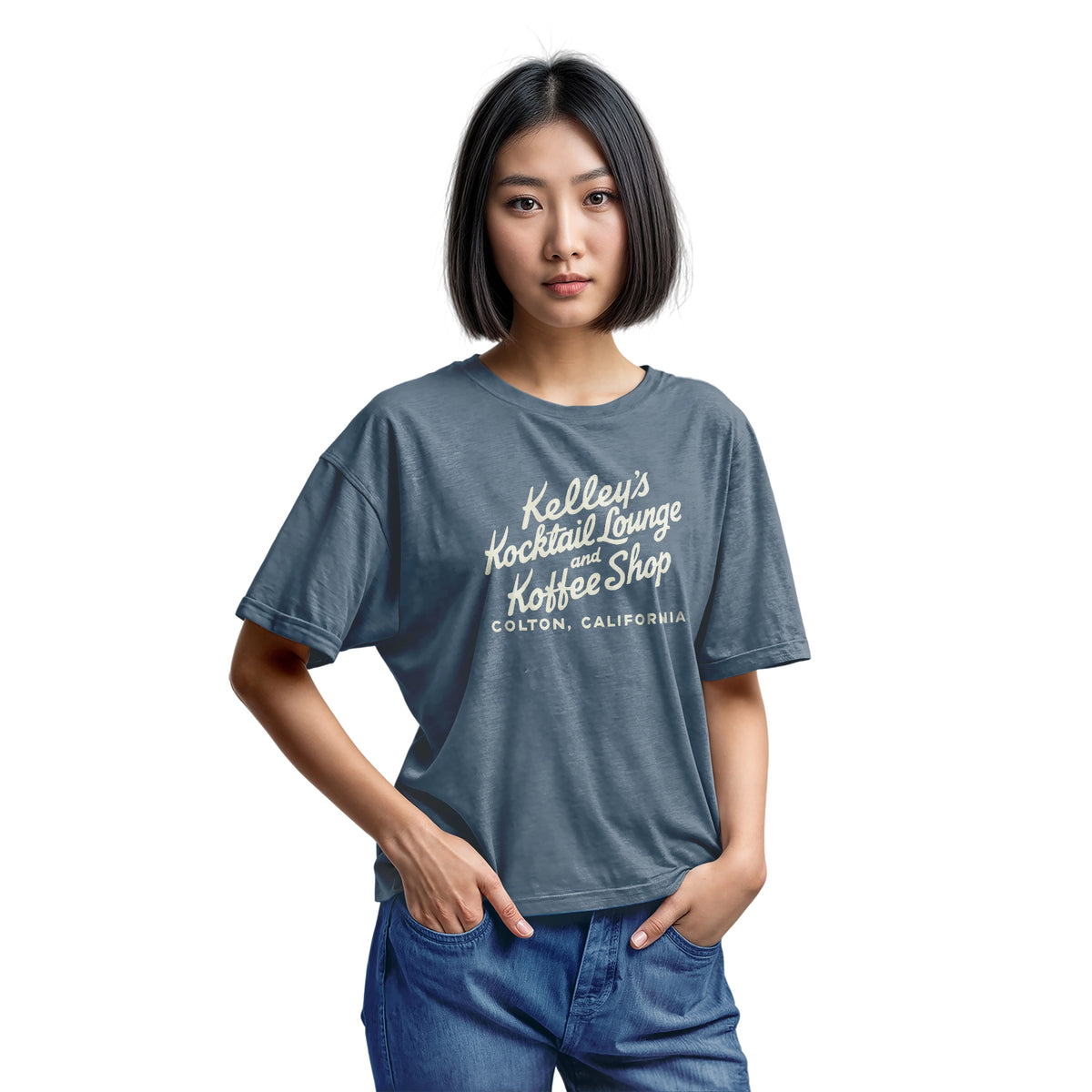 A blue t-shirt with a retro typographic advertisement for Kelley's Kocktail Lounge and Koffee Shop in Colton, California.