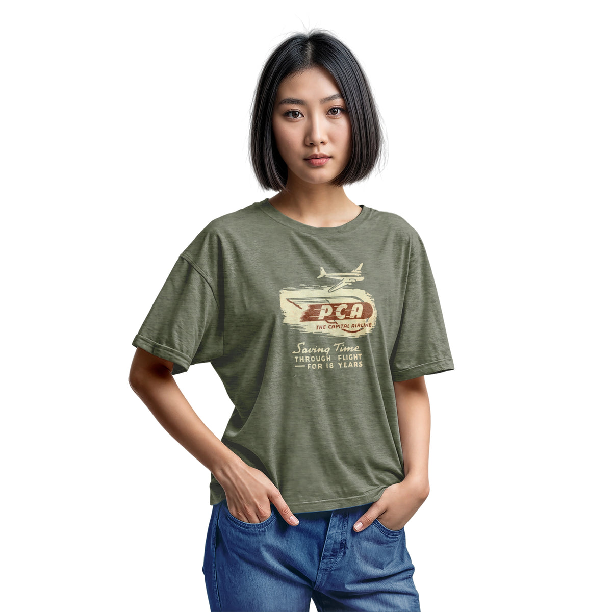 A green t-shirt featuring a vintage graphic advertisement for 'PCA THE CAPITAL AIRLINE'.