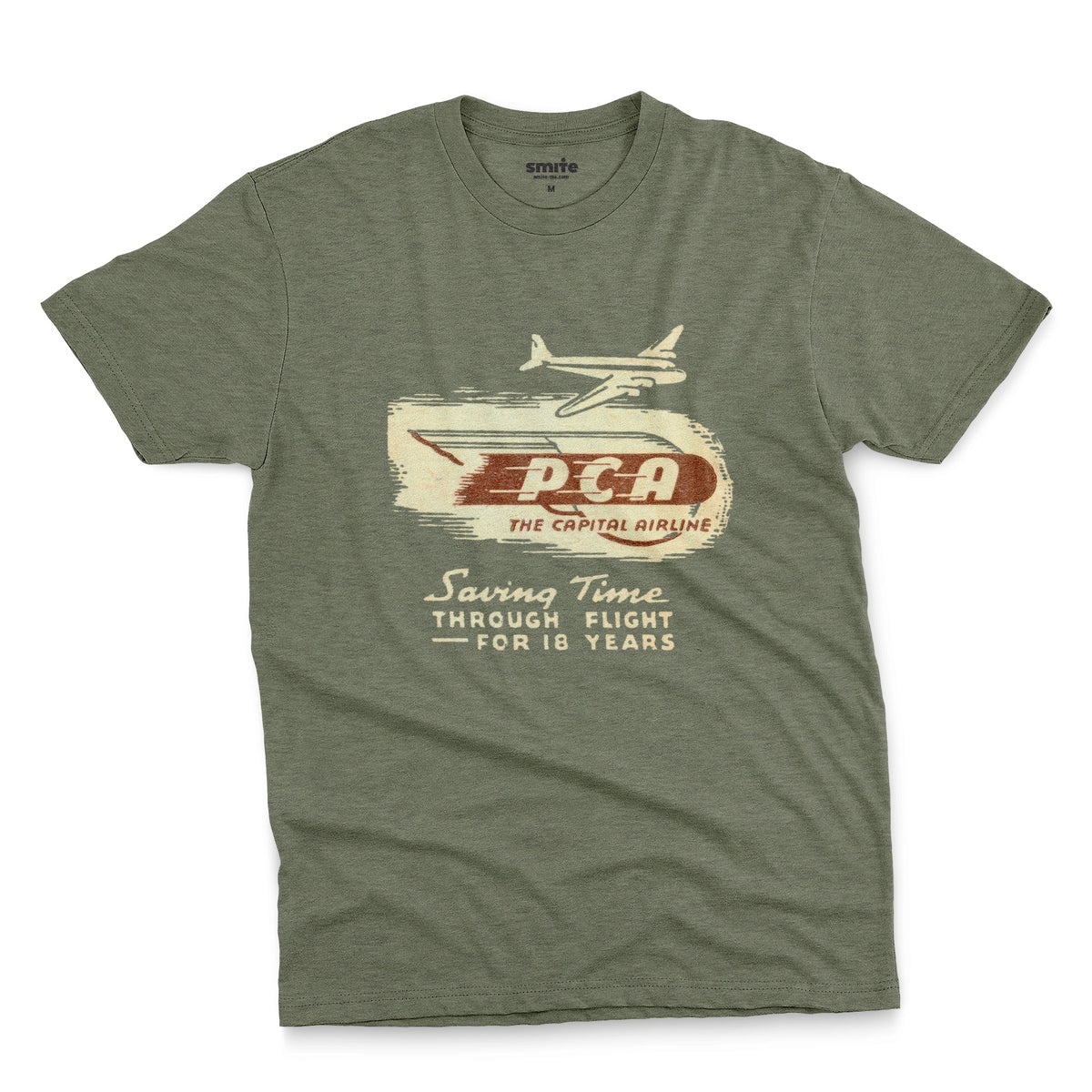 A green t-shirt featuring a vintage graphic advertisement for 'PCA THE CAPITAL AIRLINE'.