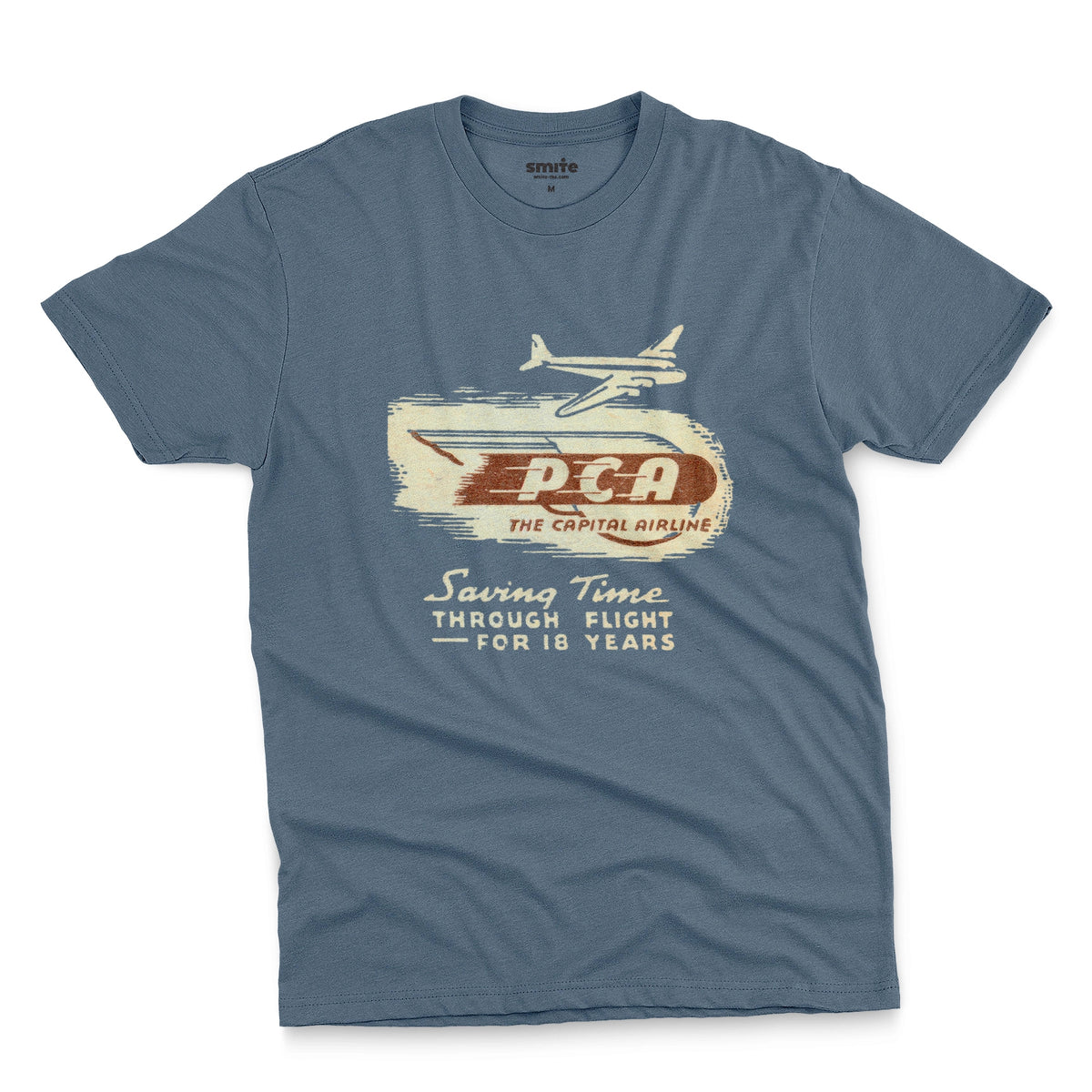 A blue t-shirt featuring a vintage graphic advertisement for 'PCA THE CAPITAL AIRLINE'.