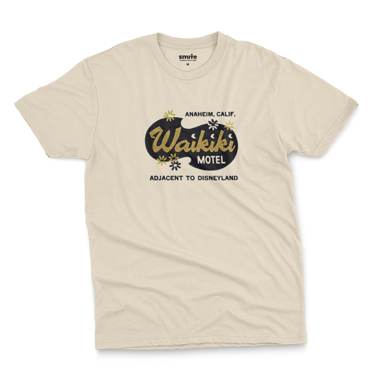 A beige t-shirt with a retro advertisement for the 'Waikiki Motel' in Anaheim, California.