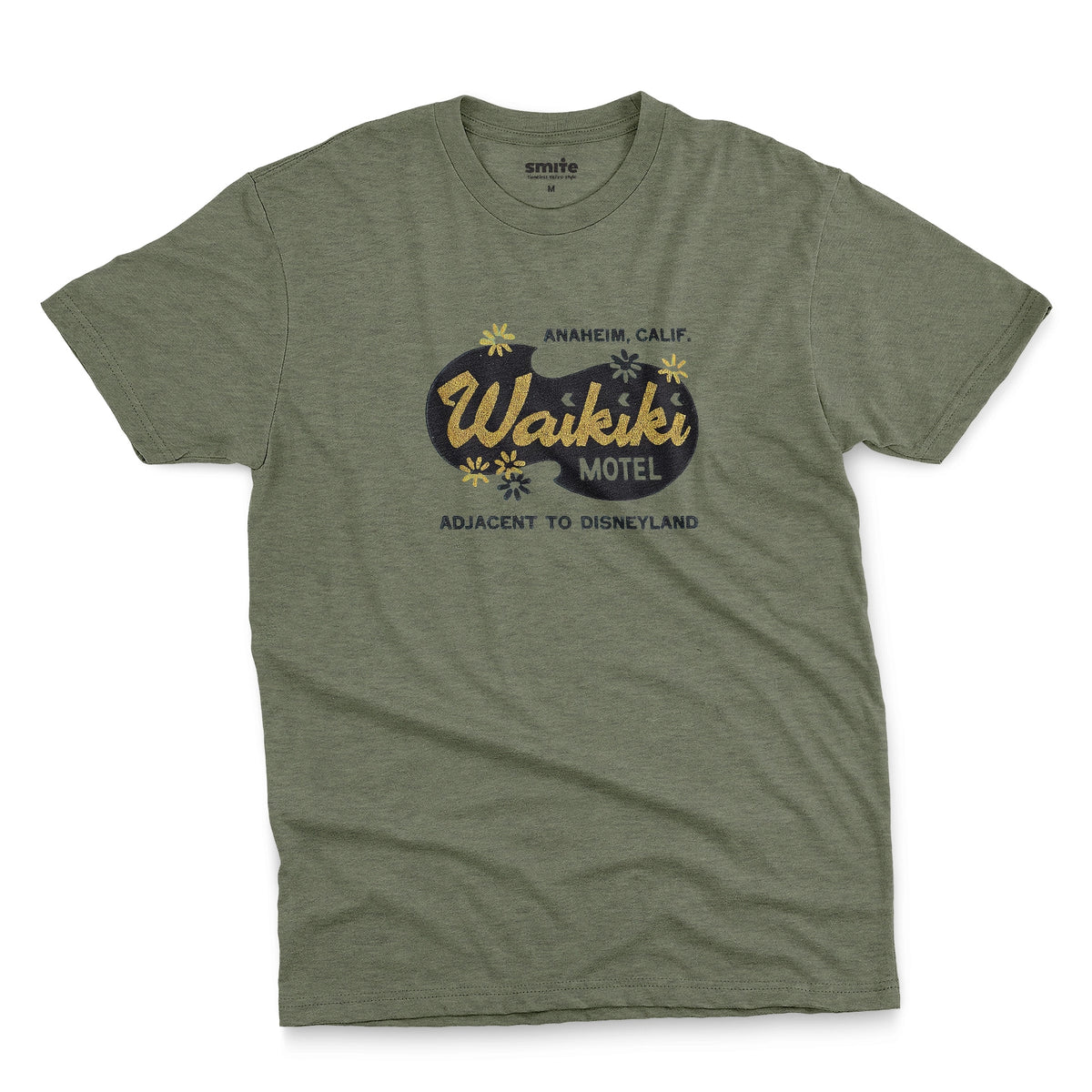 A green t-shirt with a retro advertisement for the 'Waikiki Motel' in Anaheim, California.