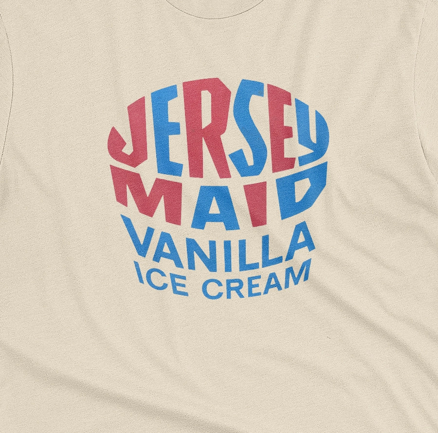 A beige t-shirt featuring a retro graphic print that reads 'JERSEY MAID VANILLA ICE CREAM' from a 1960s Australian ice cream tin lid.