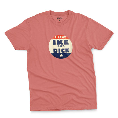 A coral pink t-shirt with  retro Eisenhower Nixon 1956 presidential campaign pin graphic.