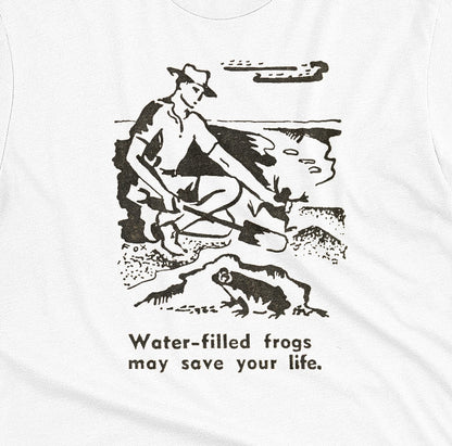 A white t-shirt with a graphic print of an illustration from a World War 2 Australian Army handbook about finding and eating frogs.