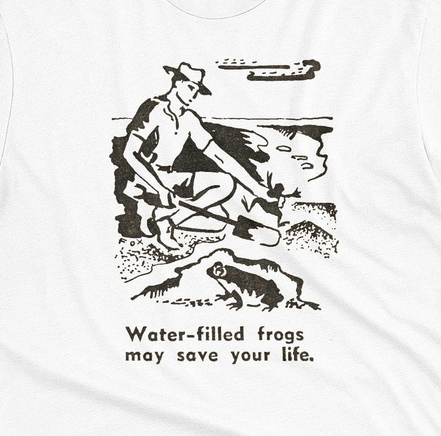 A white t-shirt with a graphic print of an illustration from a World War 2 Australian Army handbook about finding and eating frogs.