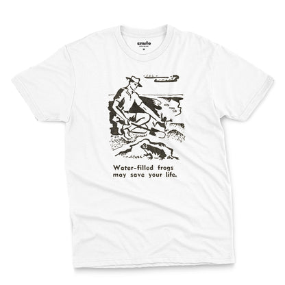 A white t-shirt with a graphic print of an illustration from a World War 2 Australian Army handbook about finding and eating frogs.