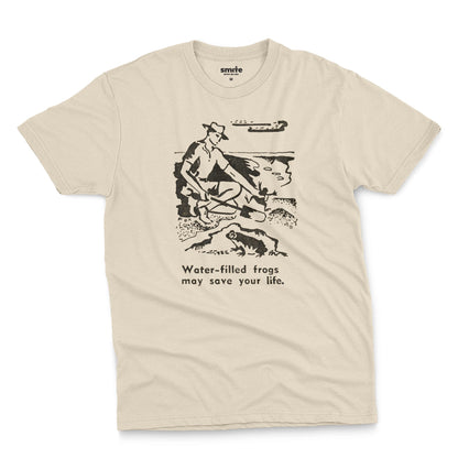 A beige t-shirt with a graphic print of an illustration from a World War 2 Australian Army handbook about finding and eating frogs.