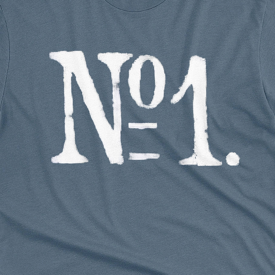 A blue t-shirt with a distressed white graphic print reading 'N°1.' on the front.