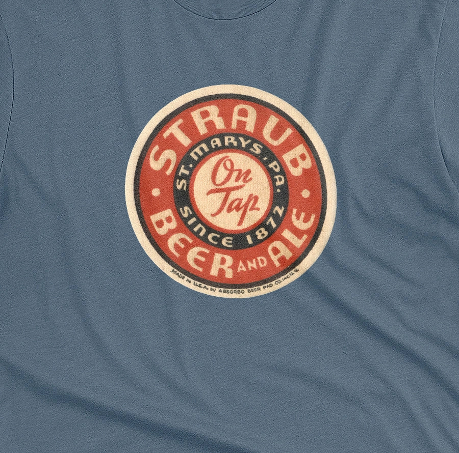 A blue t-shirt featuring circular vintage Straub Beer coaster graphics.