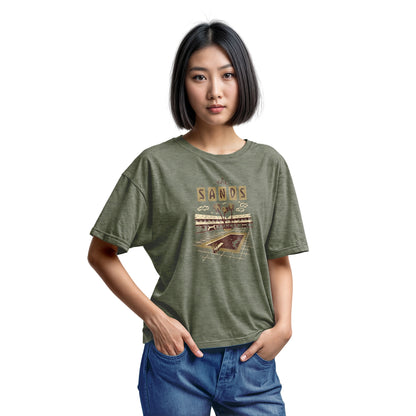 A green t-shirt with a retro advertisement for 'the SANDS' hotel featuring a poolside scene.
