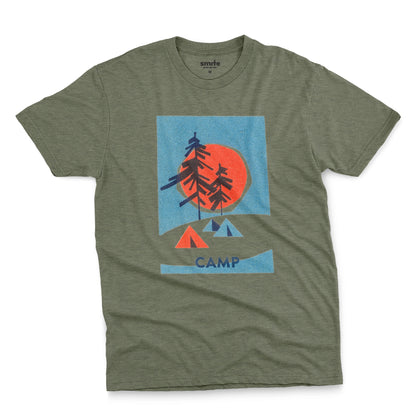 A green t-shirt featuring a 1960s retro-style graphic print of pine trees in front of a large orange-red sun within a blue square, with small orange and blue tents below and the word 'CAMP'.