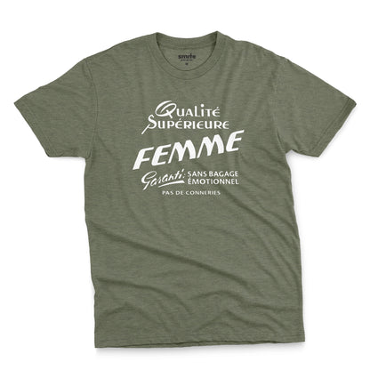 A green t-shirt with white French text printed on the front. It translates as 'Superior Quality Woman Guarantee: No Emotional Baggage'.