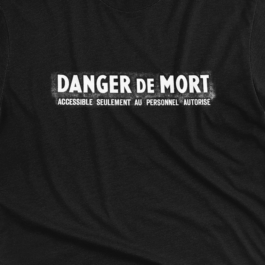 Black t-shirt with the French 'Danger De Mort' or Danger of Death in English.