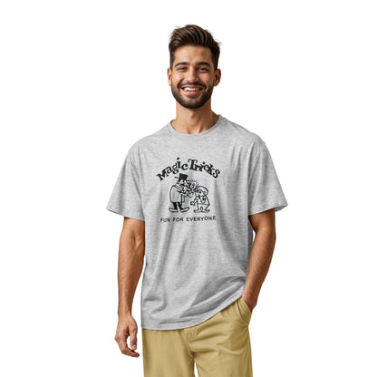 A gray marle t-shirt with a black graphic print on the front that reads 'Magic Tricks' above a cartoon of a magician and a spectator, with 'FUN FOR EVERYONE' printed below.