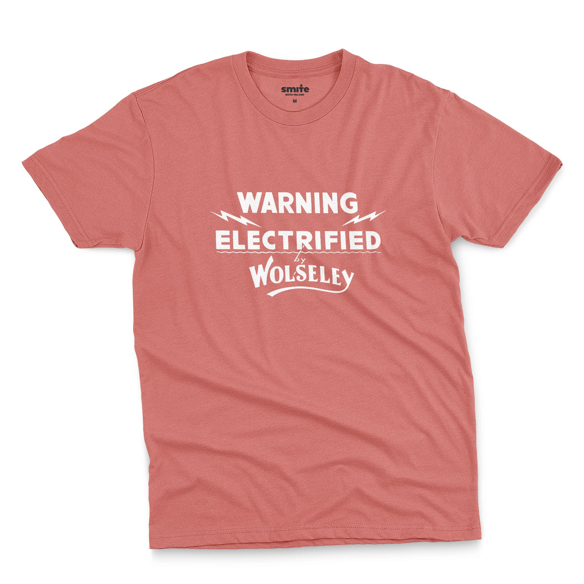 A coral pink t-shirt with vintage graphics from an electric fence sign for the Wolseley brand from the early 1900s.