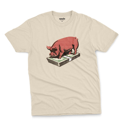 A beige t-shirt featuring a retro graphic print of a pig standing on a stack of cash.