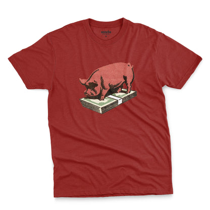A red t-shirt featuring a retro graphic print of a pig standing on a stack of cash.
