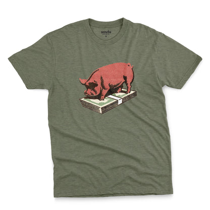 A green t-shirt featuring a retro graphic print of a pig standing on a stack of cash.