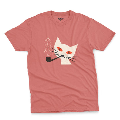 A pink t-shirt with a graphic of a white cat smoking a pipe, featuring orange eyes and black whiskers. The image is from a 1950s matchbox cover.
